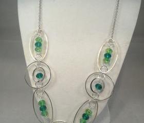 Fancy hoop and loop green necklace with green crystal accents